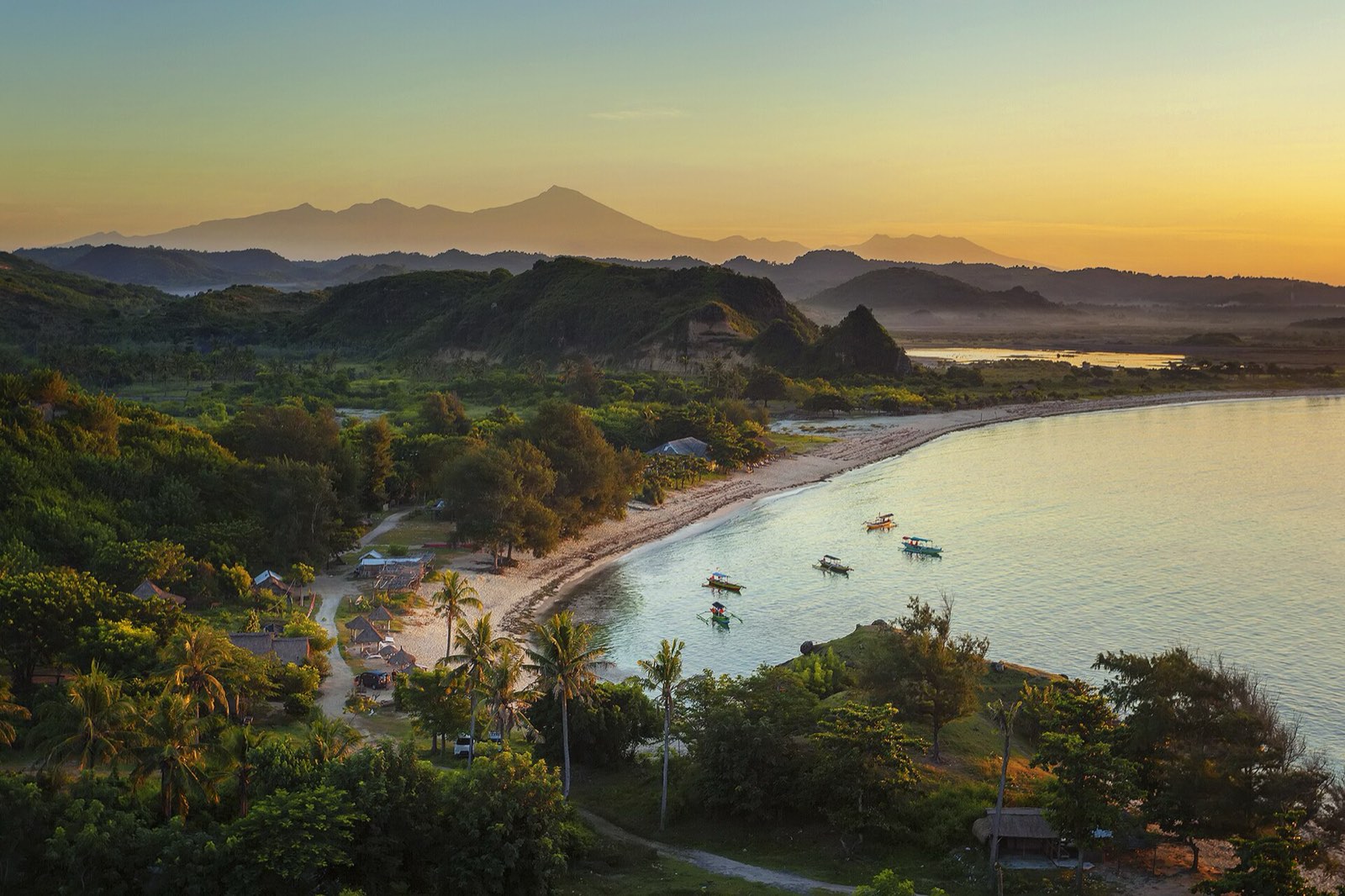Wide white-sand bay with turquoise water at Kuta Lombok on the south coast